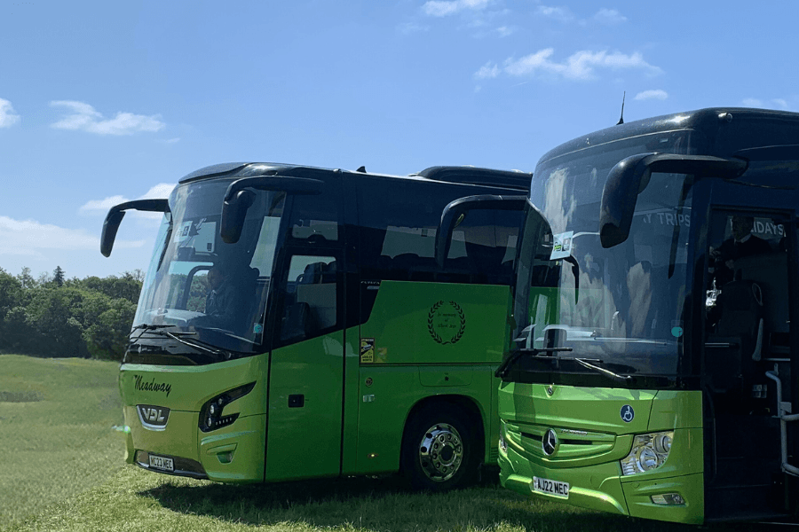 image of big green coaches